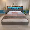 A bedroom scene featuring a bed with a headboard that has integrated lighting and storage. Produktbild-Vorschau