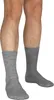 A close-up view of a person's legs wearing two pairs of gray woolen socks. Produktbild-Vorschau