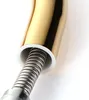 Close-up of the connection between a gold-colored faucet spout and a flexible metal hose, with a white plastic ring visible. Produktbild-Vorschau