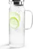 A clear studio shot of a glass carafe filled with water and lemon slices. Produktbild-Vorschau