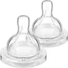 Two clear silicone baby bottle nipples are shown against a white background. Voir les images du produit