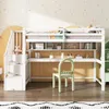 A child's loft bed with a desk and stairs, set up in a room with decorative wallpaper. Produktbild-Vorschau