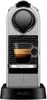 A Nespresso Krups coffee machine with a cup of espresso. Podgląd zdjęcia produktu