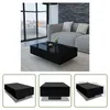 A modern living room scene with a black high-gloss coffee table in the foreground, and a sofa and large window in the background. Three smaller images below show different angles of the coffee table, with one including dimensions. Produktbild-Vorschau