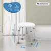 A white shower stool with adjustable legs is shown in a bathroom setting. Náhľad obrázku produktu