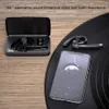 A Bluetooth headset and charging case are displayed next to a smartphone playing music, on a wooden surface and a black vinyl record. Produktbild-Vorschau