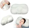 A collage of images showing a white memory foam neck pillow from different angles and a woman sleeping on it. Produktbild-Vorschau