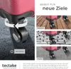 A close-up of a suitcase wheel and marketing images showing the suitcase on different surfaces. Náhled obrázku produktu