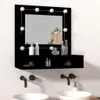 A black vanity mirror with LED lights and a shelf, mounted above two sinks with black faucets. Produktbild-Vorschau