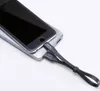 A smartphone is connected to a power bank with a black charging cable. Anteprima dell’immagine prodotto