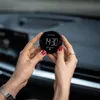 Hands holding a digital parking disc inside a car. Náhled obrázku produktu