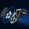 A magnetic phone holder for a car's air vent, shown with its magnetic discs and a separate magnetic plate. Voir les images du produit