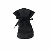 A black winter boot with laces. Produktbild-Vorschau