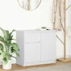 A white sideboard with drawers and a cabinet door, placed in a room with a plant and a coat rack. Voir les images du produit
