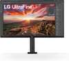A black LG UltraFine monitor displaying a landscape image and software interface, mounted on a black stand. Produktbild-Vorschau
