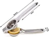 A stainless steel citrus juicer with a slice of lemon inside. Produktbild-Vorschau