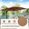 A brown rectangular patio umbrella is set up on a balcony or patio, with a table and chairs visible in the background. The image also features icons and text highlighting product features. Podgląd zdjęcia produktu