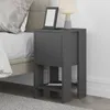 A modern nightstand next to a bed. Anteprima dell’immagine prodotto