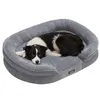 A border collie dog is lying on a gray dog bed. Produktbild-Vorschau