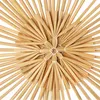 A close-up, top-down view of a star-shaped Christmas tree topper made of straw. Produktbild-Vorschau