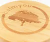 A close-up of a wooden surface with a laser-engraved logo of a tree and text. Anteprima dell’immagine prodotto