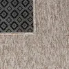 A close-up view of the corner of a rug, showing the texture of the fabric and the patterned backing. Anteprima dell’immagine prodotto