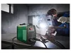 A person is welding metal with a welding machine in a workshop. Produktbild-Vorschau