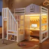 A child's loft bed with a desk and storage underneath, set up in a bedroom. Voir les images du produit