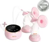 A pink electric double breast pump with bottles and a control unit, set against a white background. A circular award badge is visible in the upper right corner. Podgląd zdjęcia produktu