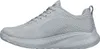 A side view of a single gray athletic shoe against a white background. Voir les images du produit