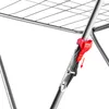 A close-up view of a red clip and a metal clamp on a silver drying rack. Anteprima dell’immagine prodotto