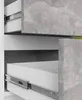 A close-up view of two open drawers in a cabinet, showing the drawer slides and the interior of the drawers. The exterior of the cabinet has a concrete-like finish. Produktbild-Vorschau