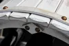 A close-up view of a white wooden wine rack with brass-colored rivets. Produktbild-Vorschau