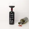 A novelty wine glass shaped like a bottle, with a second empty bottle lying on its side next to it. Náhľad obrázku produktu