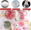 Collage showing different uses of plastic food wrap, including covering bowls of fruit, flowers, and donuts. Produktbild-Vorschau