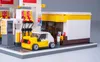 A detailed Lego model of a Shell gas station with a small car. Podgląd zdjęcia produktu