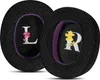 Two black ear pads for headphones, each with a letter and a floral design. Voir les images du produit