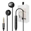 A product shot of black earphones and their packaging. Podgląd zdjęcia produktu