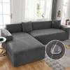A sectional sofa covered in a patterned dark gray slipcover, shown in a living room setting. A close-up inset highlights the fabric's water-repellent feature with a water droplet. Produktbild-Vorschau