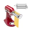 A red KitchenAid stand mixer with a silver pasta roller attachment, rolling out a sheet of yellow dough. Anteprima dell’immagine prodotto