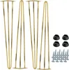 A set of four gold-colored hairpin furniture legs with black plastic floor protectors and screws, displayed on a white background. Voir les images du produit