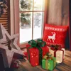 Christmas decorations on a wooden surface by a window with snow outside. Podgląd zdjęcia produktu