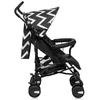 A side view of a black and white zigzag patterned baby stroller against a white background. Náhled obrázku produktu