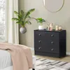 A bedroom scene with a dresser, plants, and a bed. Produktbild-Vorschau
