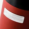 Close-up of a red product with a silver Westinghouse logo. Produktbild-Vorschau