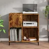 A record player and amplifier are placed on a wooden cabinet filled with vinyl records. Produktbild-Vorschau