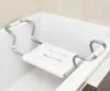 A white bathtub with a silver and white bath seat installed. Anteprima dell’immagine prodotto