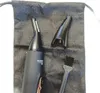 A black precision trimmer and its accessories are laid out on a black textured bag. Podgląd zdjęcia produktu