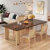 A dining room scene with a wooden table and chairs, a sofa, and a chandelier. Anteprima dell’immagine prodotto