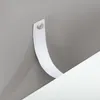 A close-up view of a white strap attached to a gray surface with a screw. Náhľad obrázku produktu